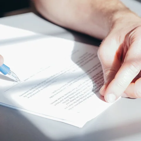 A person signing a formal legal document